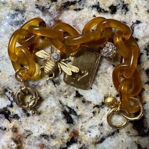 Never worn John Wind bracelet. Approx  8.5 inches. “W” initial with Bee\Ball